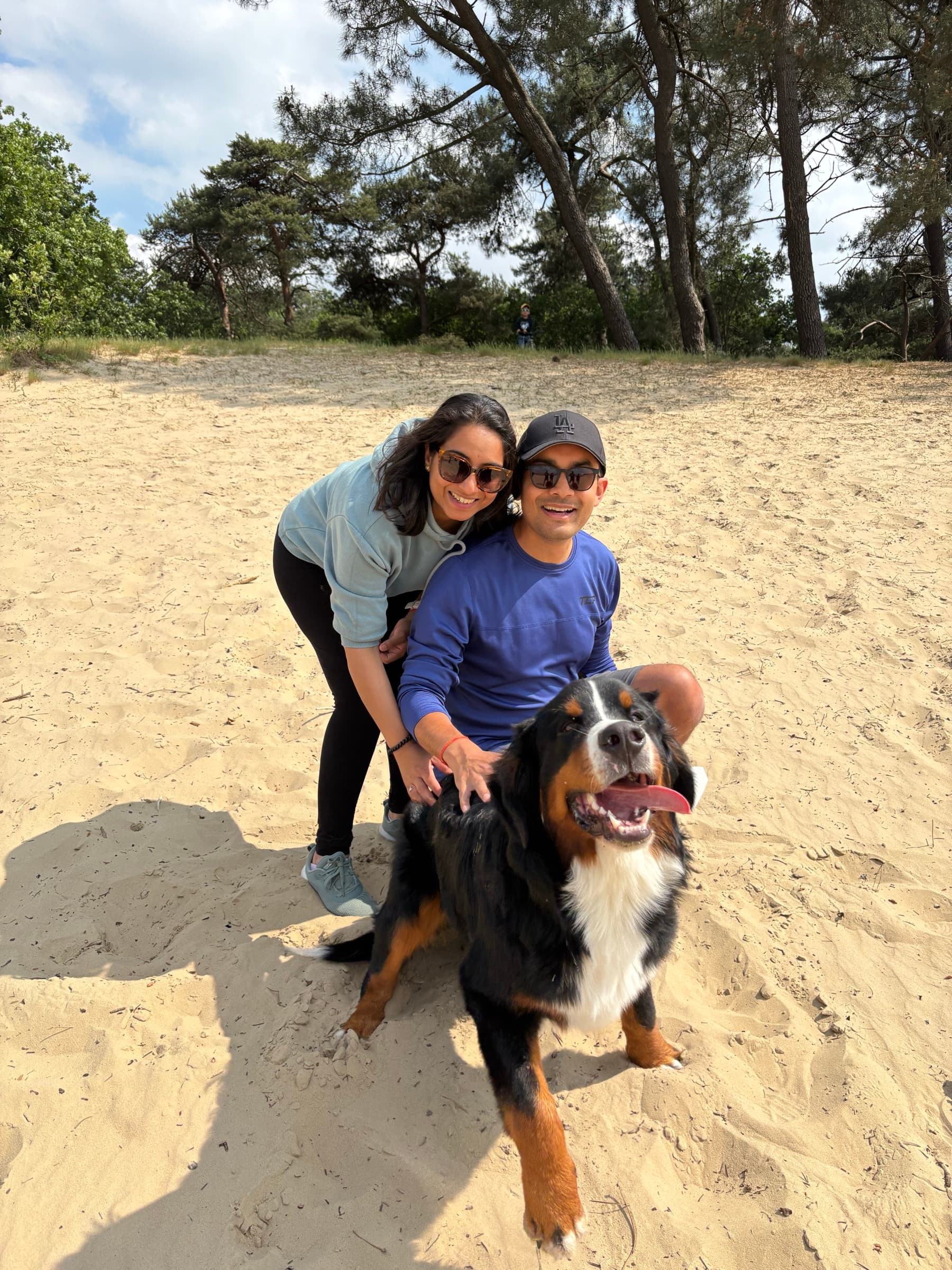 Palak and Pranav with their dog in the sand dunes