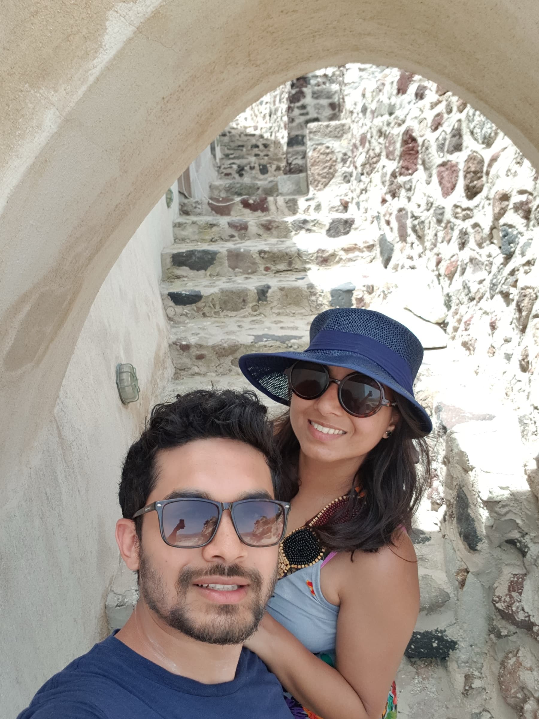 Selfie under a whitewashed stone archway